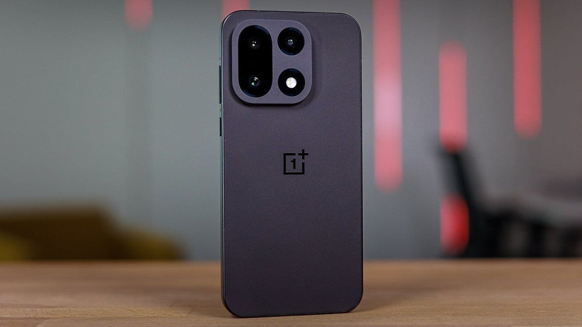 Rear view of a dark OnePlus phone on a table.