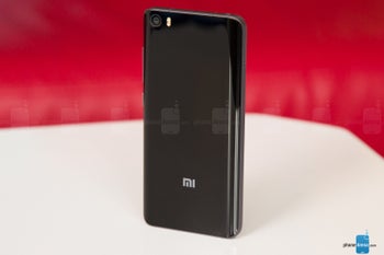 Front panel of Xiaomi 8th anniversary phone appears alongside retail packaging