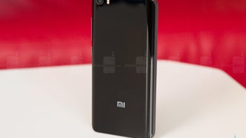 Front panel of Xiaomi 8th anniversary phone appears alongside retail packaging