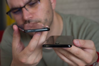Are reviewers misjudging cheaper smartphones due to their constant exposure to flagships?