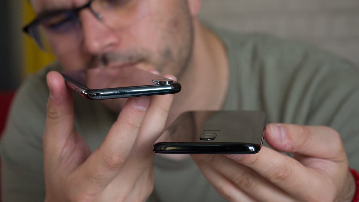 Are reviewers misjudging cheaper smartphones due to their constant exposure to flagships?