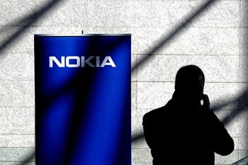 Why did Trump praise Nokia if it is outsourcing American jobs?