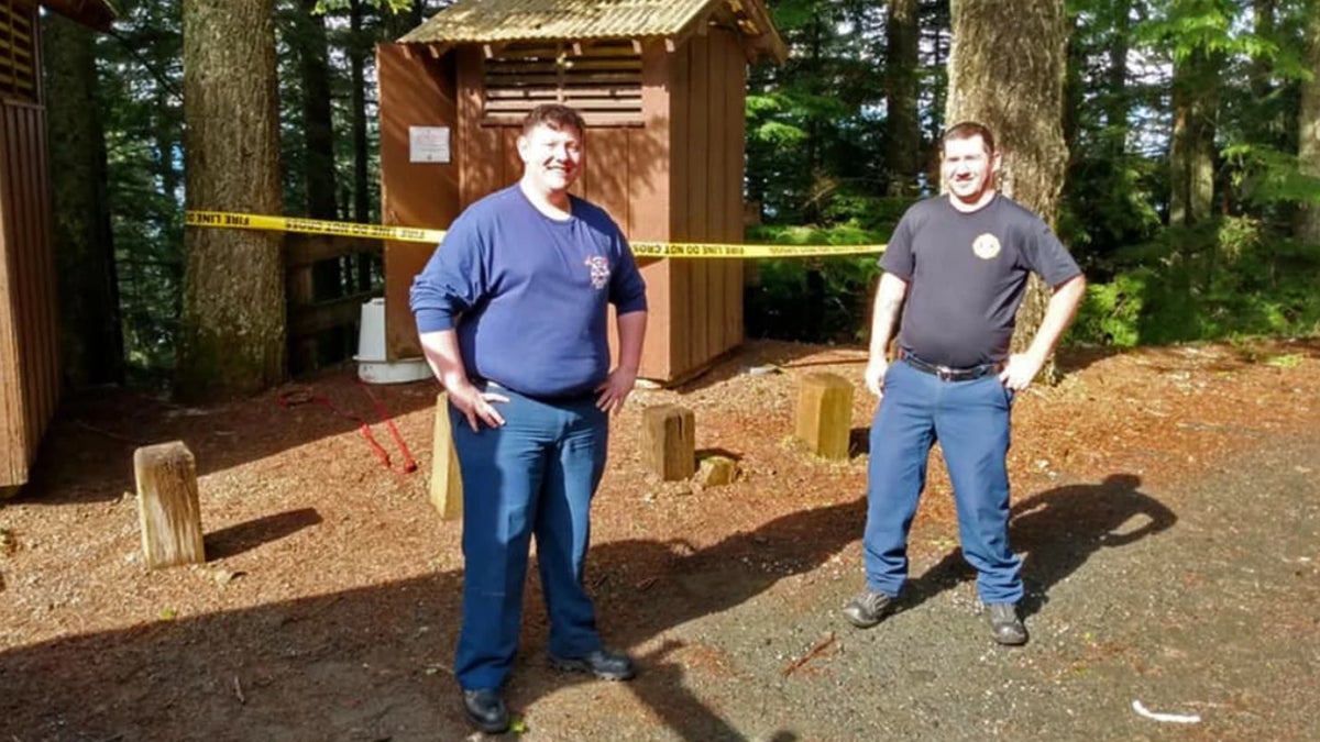 Firemen rescue women who got stuck head first in outhouse toilet trying to retrieve her phone
