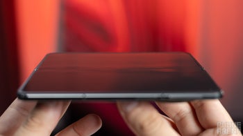 Image of the OnePlus Open held in its unfolded form showing the display