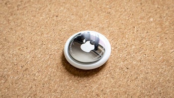 A close-up shot of the Apple AirTag item tracker.