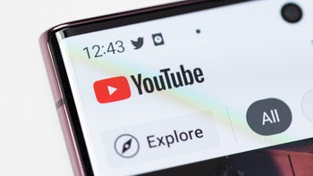 The YouTube app and its logo shot up-close on a smartphone's display.