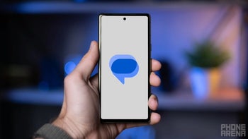 Google Messages logo displayed on a smartphone with a white background, held in a person's hand.