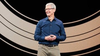 Apple CEO Tim Cook smiling at a live event.