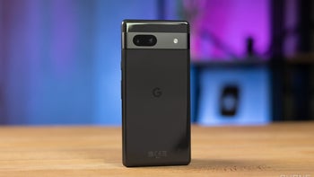 The Pixel 7a placed on a table with its back facing the camera