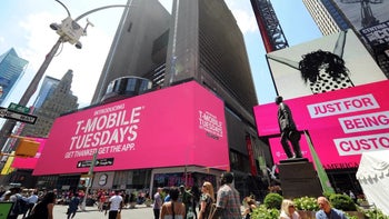 A T-Mobile storefront with a big sign promoting the T-Mobile Tuesdays reward program.