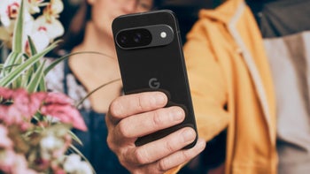 A Pixel 9 Pro XL is held in the right hand of a user who is using the Macro mode to shoot a close up.