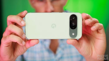 A man holding the Pixel 9 in green color.