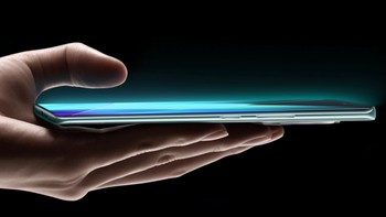 Infinix smartphone held in a person's hand displayed on a black background.