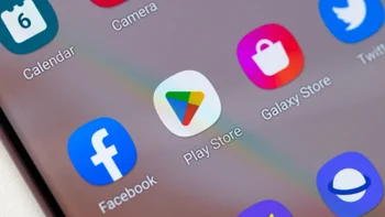 A smartphone screen from an Android device shows several icons including the one for the Google Play Store.