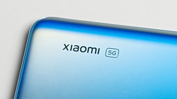 A close up shot of a phone's back where it's the logo reading Xiaomi.