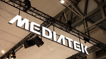 A MediaTek sign in the style of the company's logo hangs from the ceiling during an unknown trade show.