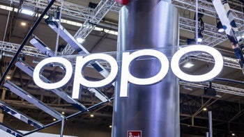 A glowing sign reading "OPPO" at a tech convention.