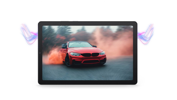 Lenovo Tab M9 with its display showing a red sports car drifting through a cloud of smoke on a road.