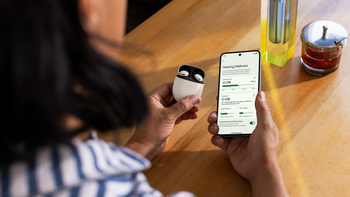 An image of a woman holding a pair of Pixel buds and a Pixel smartphone