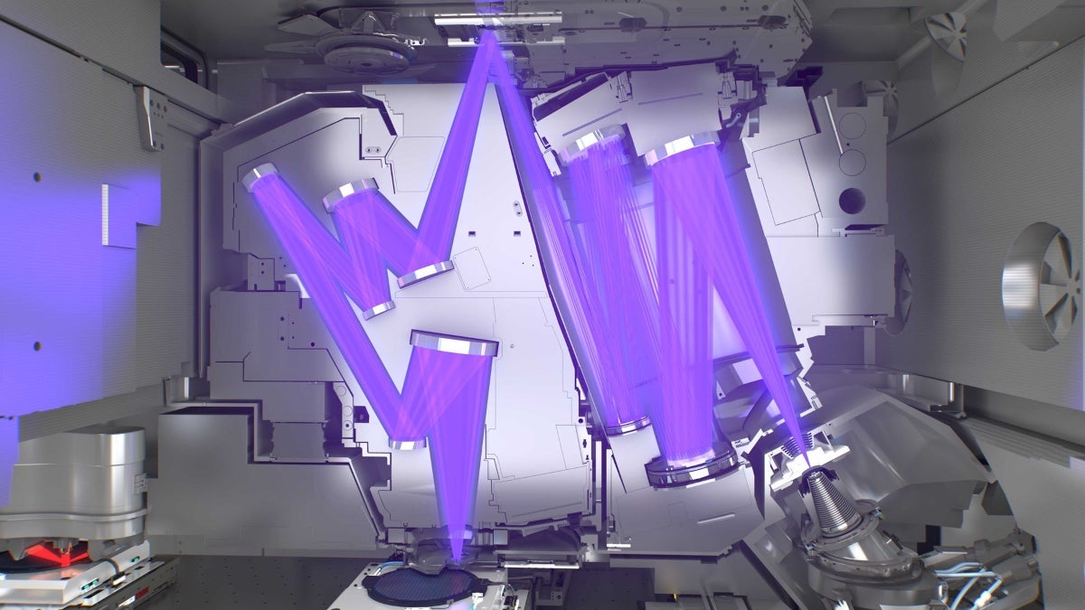 Light bounces off the reflective mirrors inside an extreme ultravilet lithography machine.