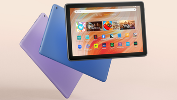 The Fire HD 10 in Lilac, Blue, and Black, showcasing its vibrant screen interface, placed on a light beige background.