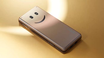 The Smiley Face phone by Oppo laying on its display.