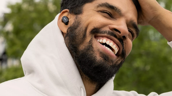 A man wearing Bose QuietComfort Earbuds II and listening to music