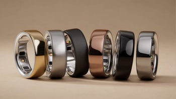 Six Oura smart rings in different finishes displayed together.