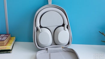 Open case showing the Sony WH-1000XM5 headphones inside.