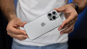 The iPhone 16 Pro held by a person.