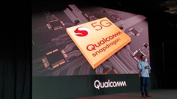 A photo of a man giving a presentation for Qualcomm chips.