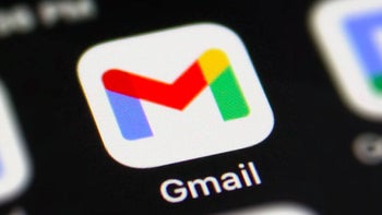 The Gmail app icon is seen in a close up against a dark black background.