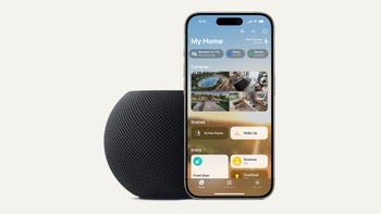 An image of an Apple Homepod Mini beside an iPhone displaying the Home app