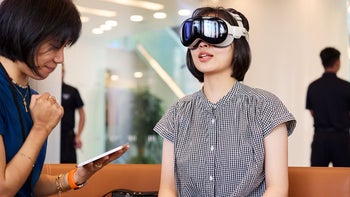 A woman trying out the Apple Vision Pro at its international launch