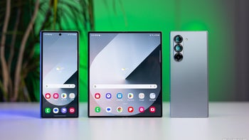 Three Samsung Galaxy Z Fold 6 phones displayed against a softly lit green background.