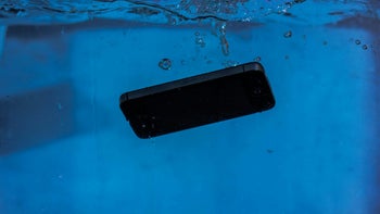 A phone submurged in a body of water.