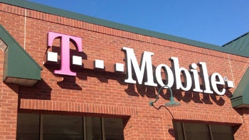 On a brick building used as a T-Mobile retail store, the carrier's wordmark and magenta-hued "T" logo are spotted.