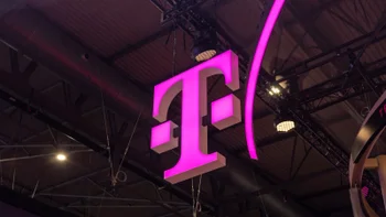 The iconic T-Mobile "T" logo appears on a lighted sign in magenta.