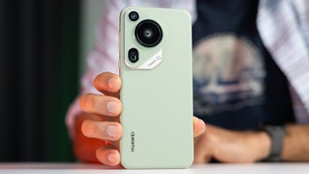 The Huawei Pura 70 Ultra is propped up with the rear camera island facing the camera.