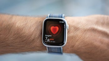 A person's hand with an Apple Watch on it, shot from up close.