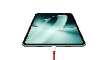 OnePlus Pad with a charging cable attached to its USB-C port, set against on a white background.