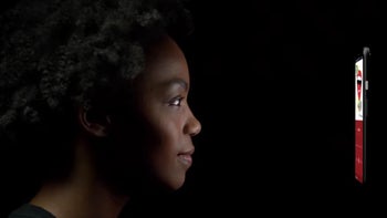 An image of a woman unlocking a Pixel device with her face in the dark