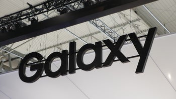 The "Galaxy" wordmark used by Samsung is shown high on the ceiling of a building.