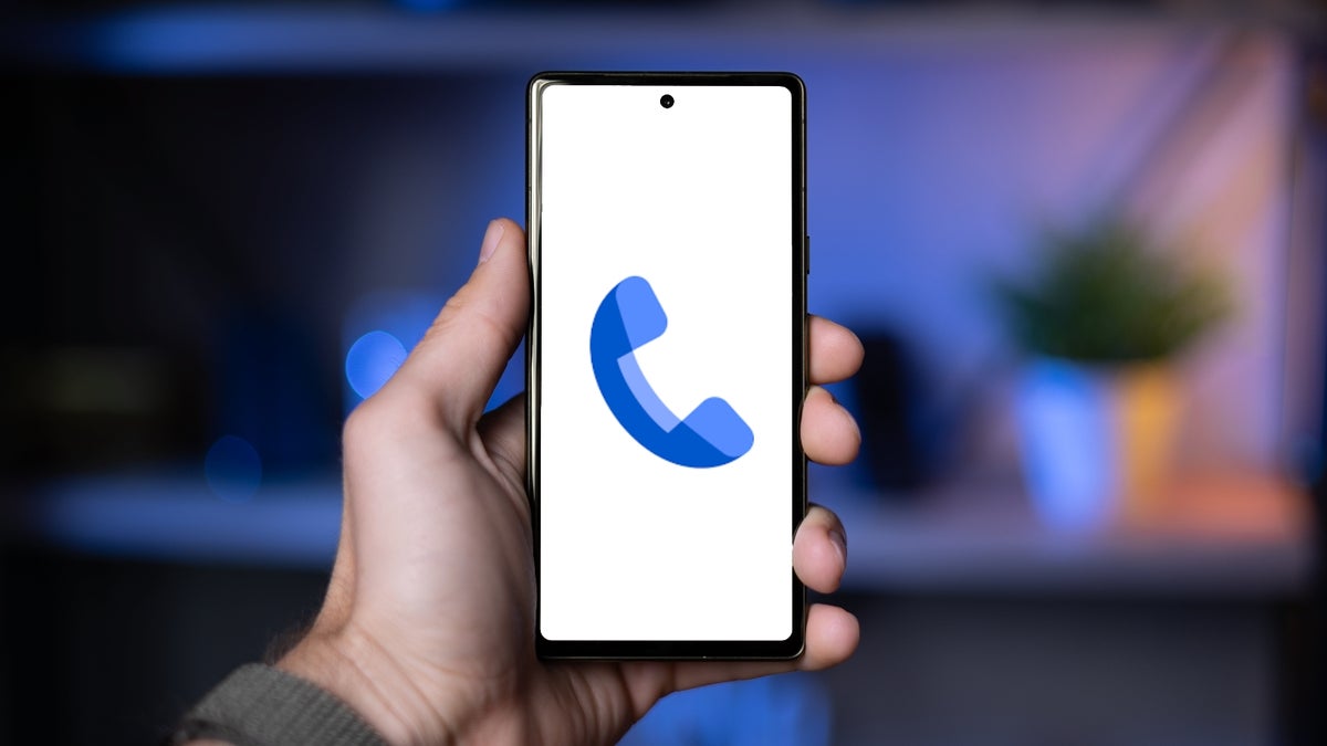 An image of a phone being held displaying the Pixel phone app on its screen