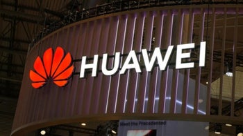 The Huawei logo shot at a tech fair.