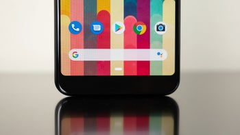 The front of a black Google Pixel smartphone, displaying the home screen and the Google search bar.