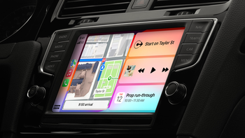 A car's dashboard displaying a large touchscreen with CarPlay on it.