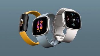 The Fitbit Sense 2, Versa 4, and Inspire 3 smartwatches on a grey background.