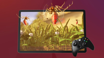 A Lenovo Tab P12 tablet displaying a vivid close-up of insects in grass, paired with a black gamin controller.