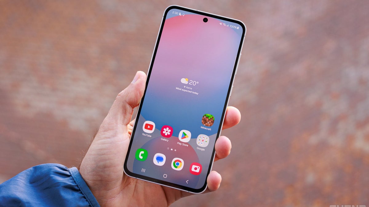 A person holding a Galaxy S24 FE